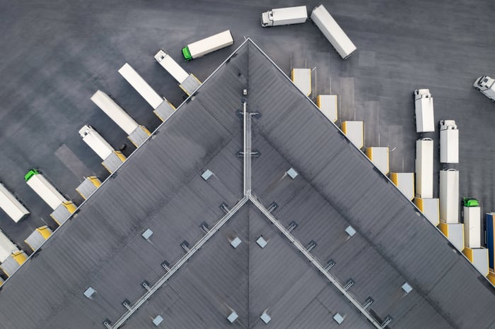 Aerial view of trucks docked at a distribution centre